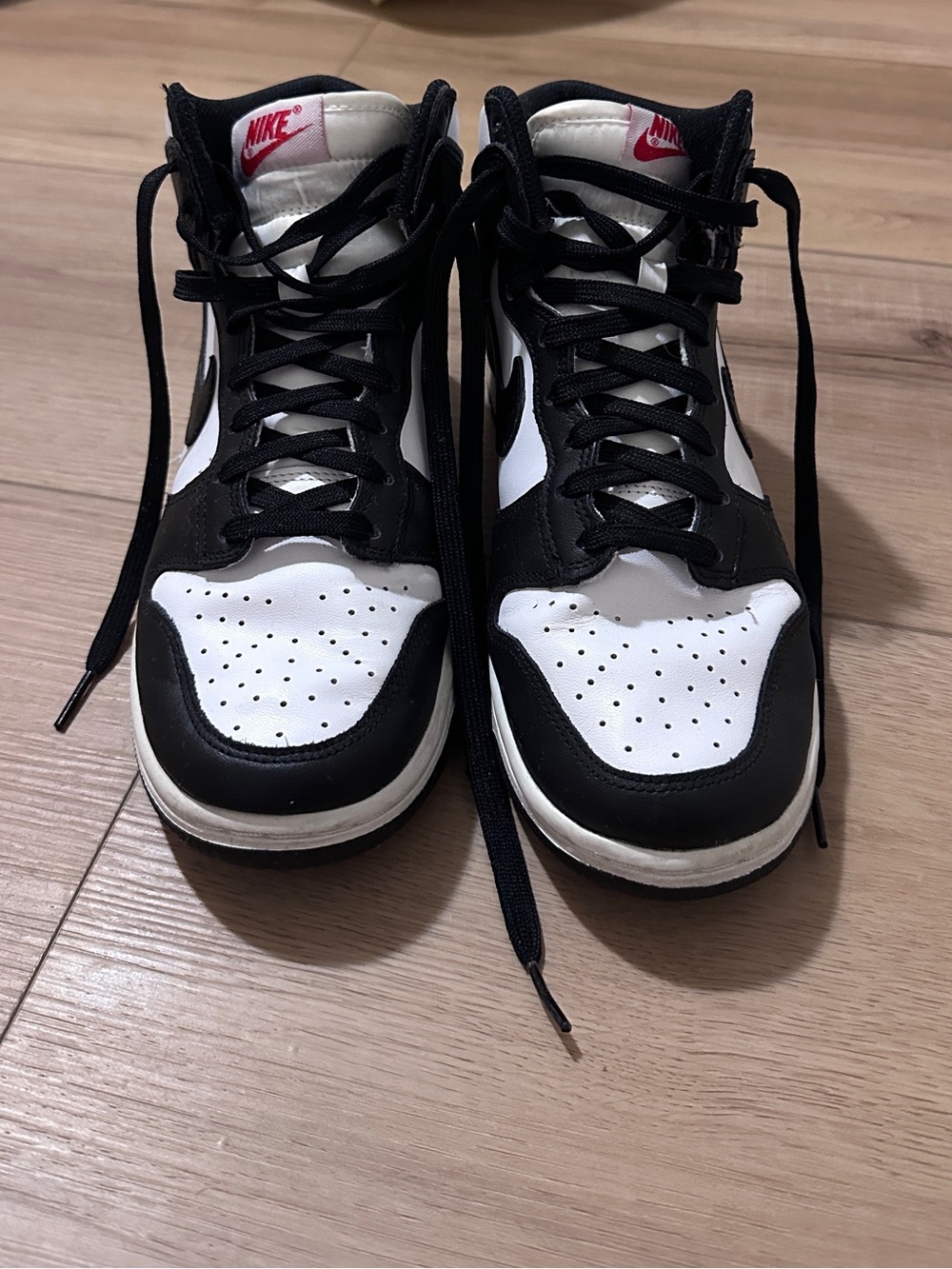 Nike Black and White High-Top Sneakers with Pink Logo